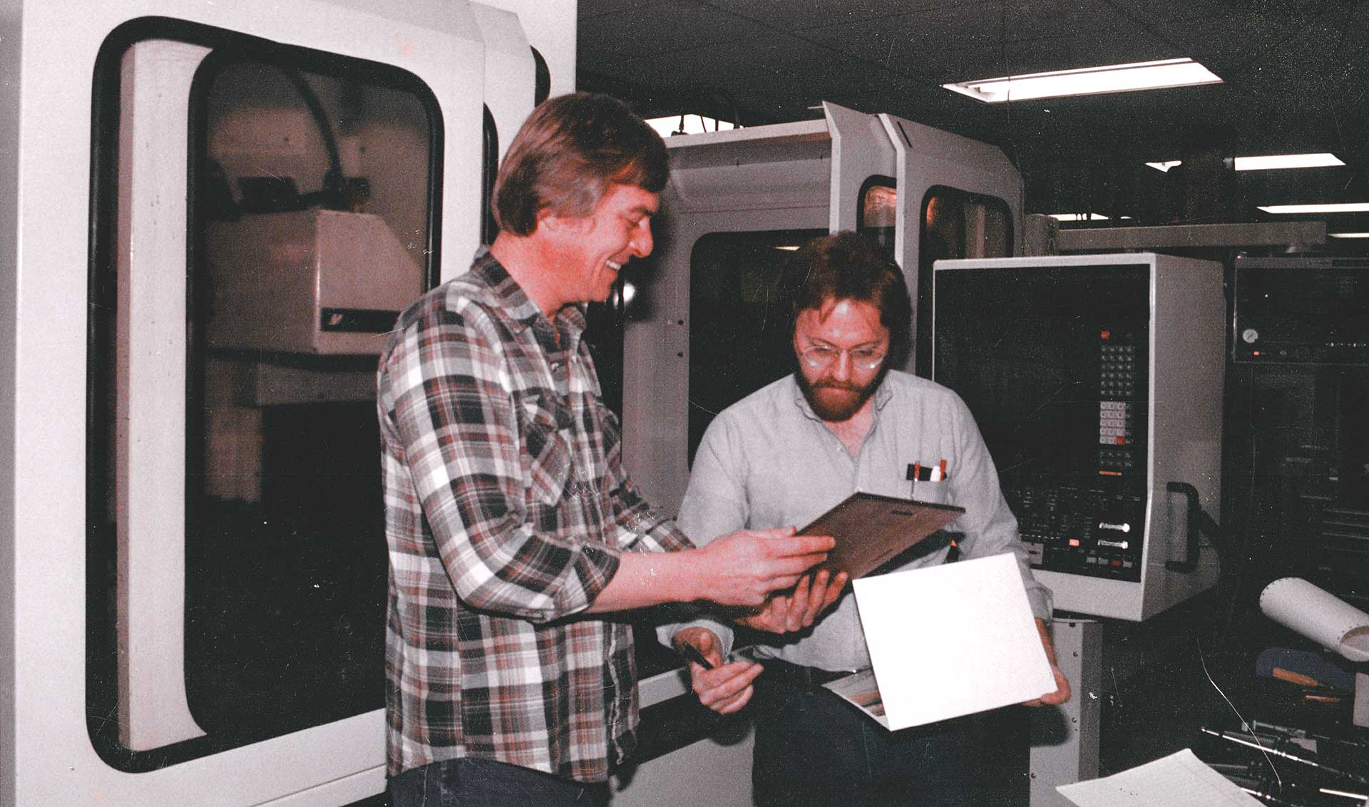 Glenn Isaacson and Rick Rasmussen with the award for Excellence in Manufacturing